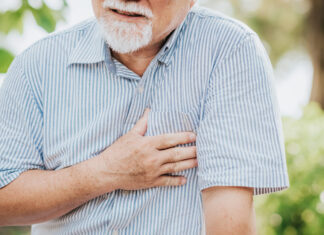 Low physical function tied to higher cardiac risk in older adults Cropped shot of senior man holding his chest and feeling pain suffering from heart attack outdoor at the park