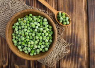 Frozen Vegetables That Are Healthier Than Fresh Frozen peas in a brown bowl