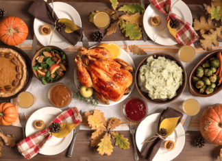 Enjoy Thanksgiving while sticking to health goals A vibrant and colorful Thanksgiving meal spread with turkey, mashed potatoes, Waldorf salad, pumpkin pie, Brussel