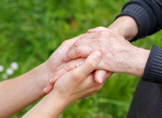 Pancreas cancer awareness; Aging and loneliness Young and elderly people's hands