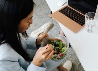 Boost your brainpower: 10 healthy desk snacks to keep you focused at work Person eating healthy