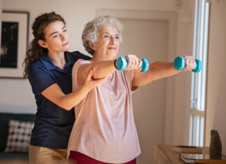 We May Have Longer Life Spans but We Don’t Have Longer Health Spans Woman with assisted exercising for longer health