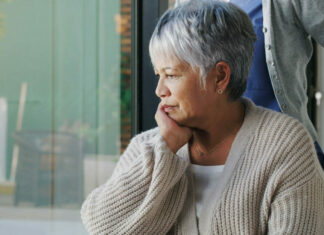 Study: Seniors struggle with mental healthcare access after transitioning to Medicare Shot of a senior woman in a wheelchair looking sad, depressed at a nursing home